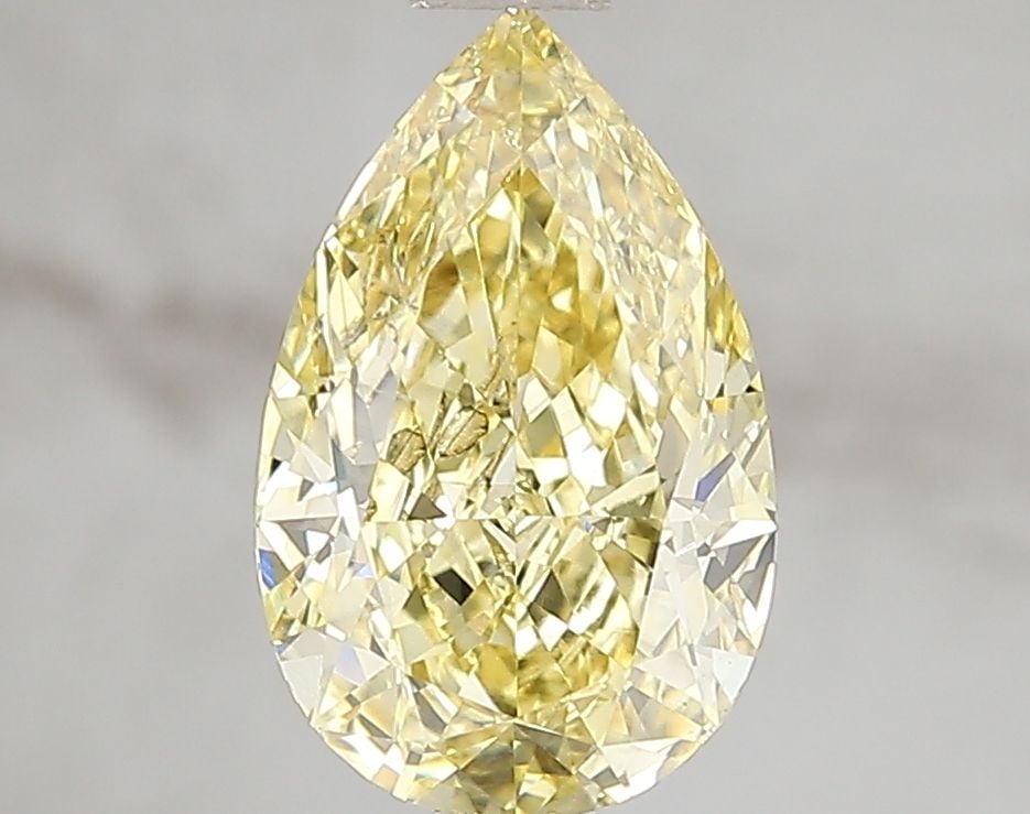Loose Diamond - PEAR 2.02ct Fancy Vivid Yellow SI1: Loose Diamond - PEAR 2.02ct Fancy Vivid Yellow SI1 Source: This is a real non-mined Diamond that has been grown in a lab Shape: PEAR Carats: 2.02 Color: Fancy Vivid Yellow Certification: IGI Video: