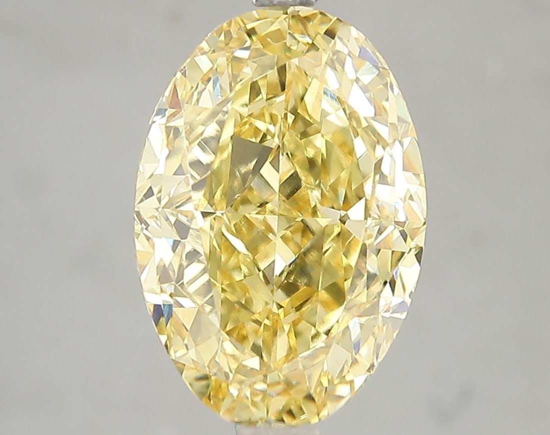 Loose Diamond - OVAL 5.03ct Fancy Vivid Yellow VS2: Loose Diamond - OVAL 5.03ct Fancy Vivid Yellow VS2 Source: This is a real non-mined Diamond that has been grown in a lab Shape: OVAL Carats: 5.03 Color: Fancy Vivid Yellow Certification: IGI Video: