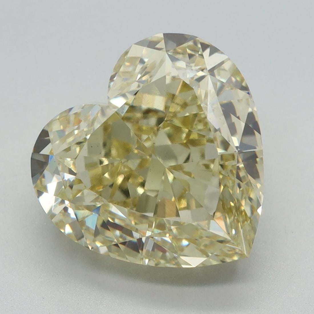 Loose Diamond - HEART 5.3ct Fancy Yellow VS1: Loose Diamond - HEART 5.3ct Fancy Yellow VS1 Source: This is a real non-mined Diamond that has been grown in a lab Shape: HEART Carats: 5.3 Color: Fancy Yellow Certification: IGI Video: