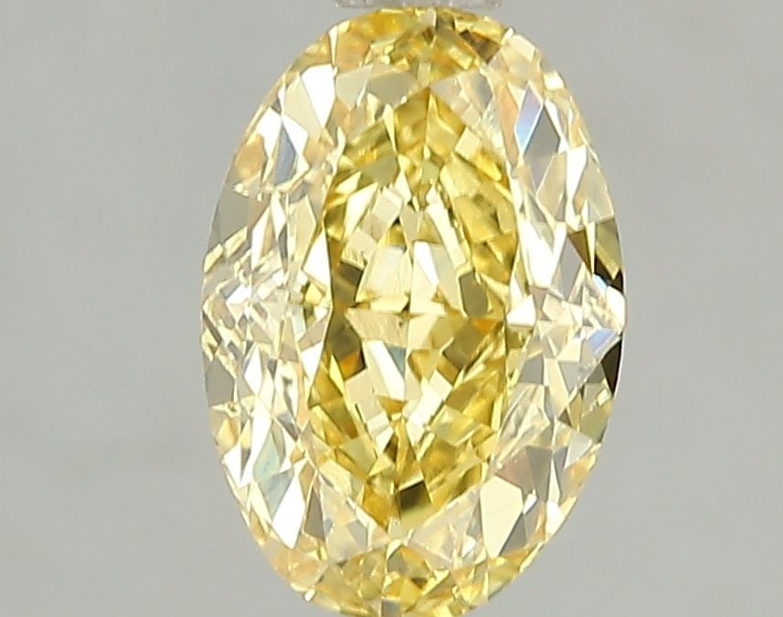 Loose Diamond - OVAL 2.05ct Fancy Vivid Yellow VS2: Loose Diamond - OVAL 2.05ct Fancy Vivid Yellow VS2 Source: This is a real non-mined Diamond that has been grown in a lab Shape: OVAL Carats: 2.05 Color: Fancy Vivid Yellow Certification: IGI Video: