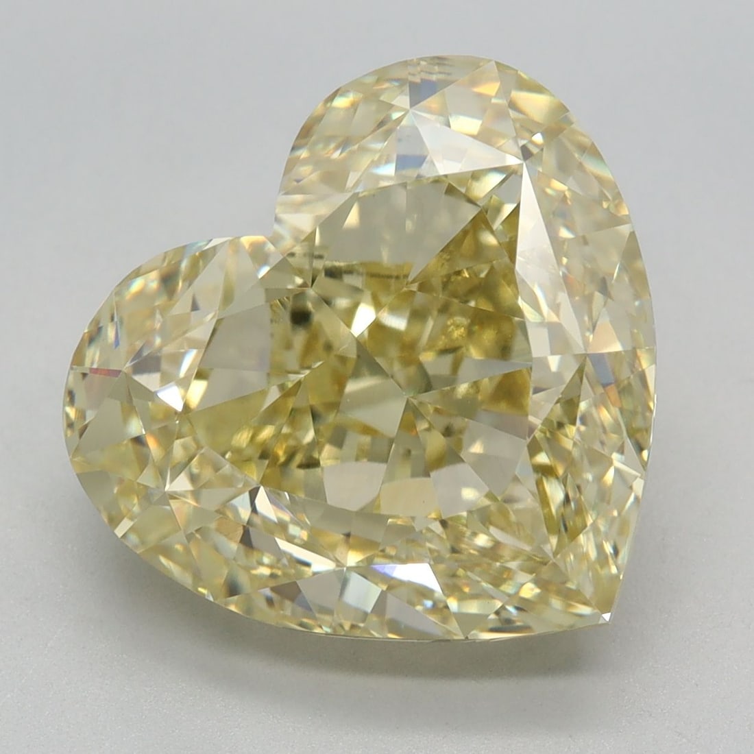 Loose Diamond - HEART 7.29ct Fancy Yellow VVS2: Loose Diamond - HEART 7.29ct Fancy Yellow VVS2 Source: This is a real non-mined Diamond that has been grown in a lab Shape: HEART Carats: 7.29 Color: Fancy Yellow Certification: IGI Video: