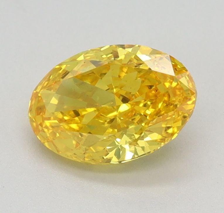 Loose Diamond - OVAL 0.77ct Fancy Vivid Yellow VS2: Loose Diamond - OVAL 0.77ct Fancy Vivid Yellow VS2 Source: This is a real non-mined Diamond that has been grown in a lab Shape: OVAL Carats: 0.77 Color: Fancy Vivid Yellow Certification: IGI Video: