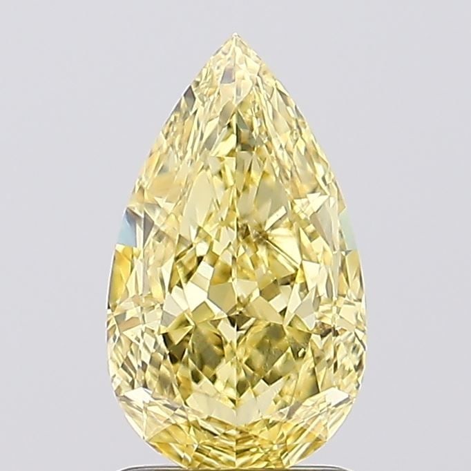 Loose Diamond - PEAR 1.73ct Fancy Vivid Yellow VS1: Loose Diamond - PEAR 1.73ct Fancy Vivid Yellow VS1 Source: This is a real non-mined Diamond that has been grown in a lab Shape: PEAR Carats: 1.73 Color: Fancy Vivid Yellow Certification: IGI Video: