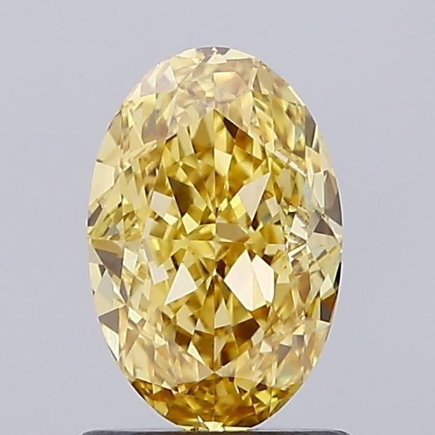 Loose Diamond - OVAL 1.18ct Fancy Vivid Yellow VS1: Loose Diamond - OVAL 1.18ct Fancy Vivid Yellow VS1 Source: This is a real non-mined Diamond that has been grown in a lab Shape: OVAL Carats: 1.18 Color: Fancy Vivid Yellow Certification: IGI Video: