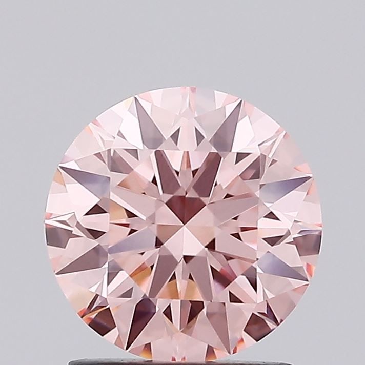 Ideal Loose Diamond - ROUND 1.55ct Fancy Vivid Pink VVS2: Ideal Loose Diamond - ROUND 1.55ct Fancy Vivid Pink VVS2 Source: This is a real non-mined Diamond that has been grown in a lab Shape: ROUND Carats: 1.55 Color: Fancy Vivid Pink Certification: IGI Vide