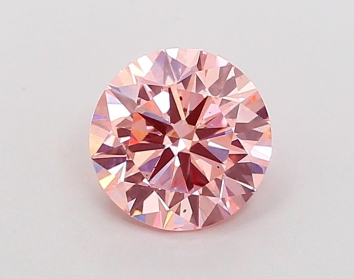 Ideal Loose Diamond - ROUND 1.14ct Fancy Vivid Pink VS2: Ideal Loose Diamond - ROUND 1.14ct Fancy Vivid Pink VS2 Source: This is a real non-mined Diamond that has been grown in a lab Shape: ROUND Carats: 1.14 Color: Fancy Vivid Pink Certification: IGI Video
