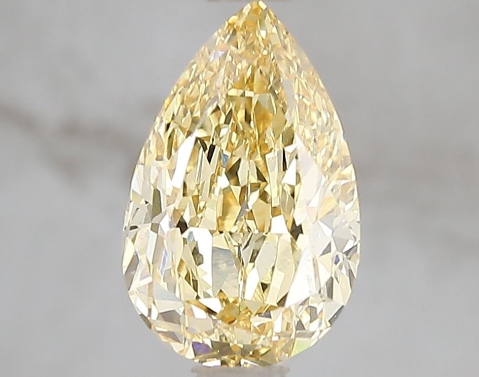 Loose Diamond - PEAR 2.0ct Fancy Vivid Yellow VS1: Loose Diamond - PEAR 2.0ct Fancy Vivid Yellow VS1 Source: This is a real non-mined Diamond that has been grown in a lab Shape: PEAR Carats: 2.0 Color: Fancy Vivid Yellow Certification: IGI Video: