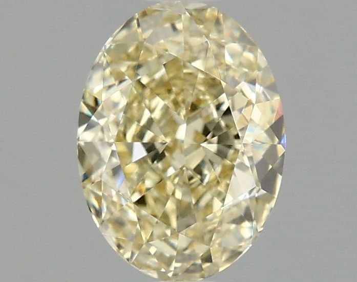 Loose Diamond - OVAL 1.54ct Fancy Light Yellow VVS2: Loose Diamond - OVAL 1.54ct Fancy Light Yellow VVS2 Source: This is a real non-mined Diamond that has been grown in a lab Shape: OVAL Carats: 1.54 Color: Fancy Light Yellow Certification: IGI Video: