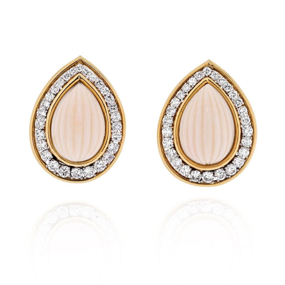 David Webb 18K Yellow Gold Coral Diamond Pear Drop Earrings: David Webb 18K Yellow Gold Coral Diamond Pear Drop Earrings Make a statement with these exquisite David Webb earrings featuring light pink fluted coral set in a stunning design. Crafted from a combina