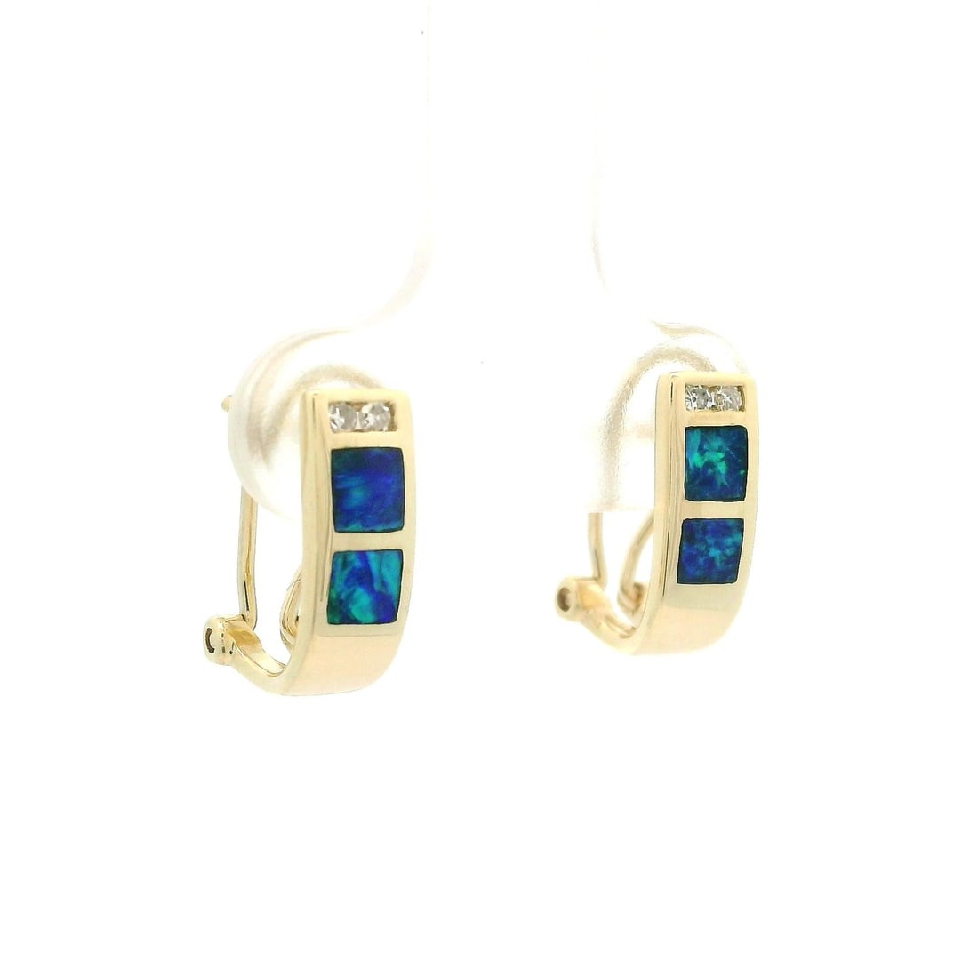 14k Yellow Gold Omega Cuff Earrings with Opal and Diamond Inlay: 14k Yellow Gold Omega Cuff Earrings with Opal and Diamond Inlay These exquisite cuff earrings feature a stunning inlay of genuine opals and diamonds, set in solid 14k yellow gold. Each earring showcas