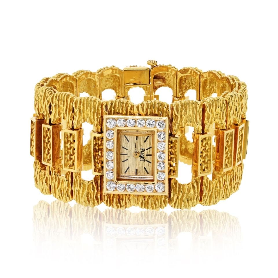 Piaget Vintage 18K Yellow Gold Watch 105.6g Luxury Timepiece: Piaget Vintage 18K Yellow Gold Watch 105.6g Luxury Timepiece This exquisite vintage watch by Piaget is crafted from luxurious 18K yellow gold, weighing an impressive 105.6 grams. A timeless piece that