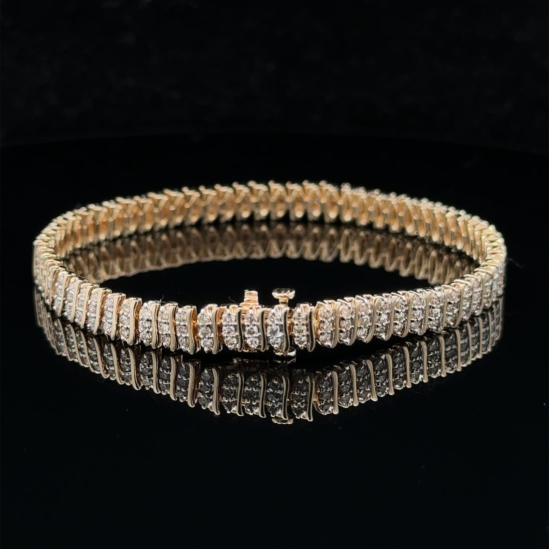 14k Yellow Gold Champagne Diamond 3 Row Tennis Bracelet 2.50-3ctw: 14k Yellow Gold Champagne Diamond 3 Row Tennis Bracelet 2.50-3ctw This exquisite tennis bracelet features a stunning design crafted from 14k yellow gold, showcasing three rows of natural genuine diamo