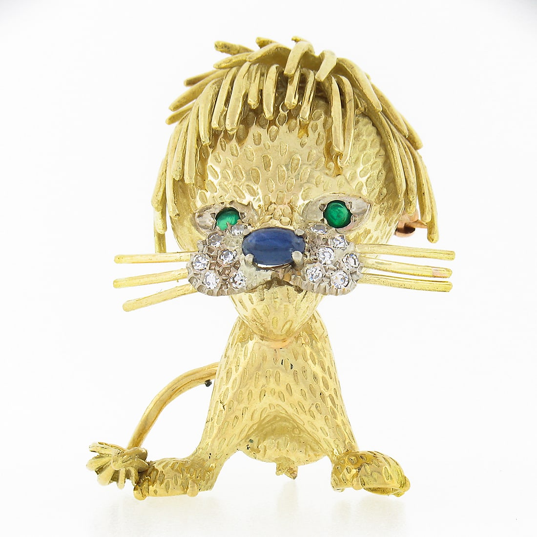 Unique Vintage 18K Gold Lion Brooch Pendant with Diamonds Emeralds Sapphires: Unique Vintage 18K Gold Lion Brooch Pendant with Diamonds Emeralds Sapphires This unique vintage brooch or pendant is crafted in solid 18K yellow gold, featuring a charming cartoony lion design. The p