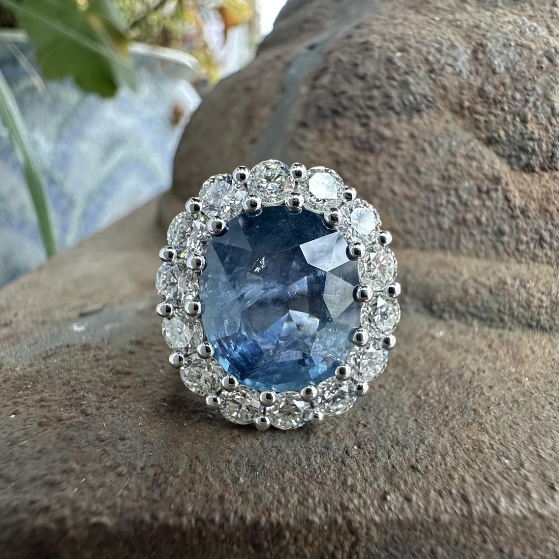 Platinum Ring with 10.06ct No Heat Burma Sapphire and Diamond Halo GIA Certified: Platinum Ring with 10.06ct No Heat Burma Sapphire and Diamond Halo GIA Certified This platinum ring features a natural, no-heat Burma sapphire weighing 10.06 carats, certified by GIA. The sapphire dis