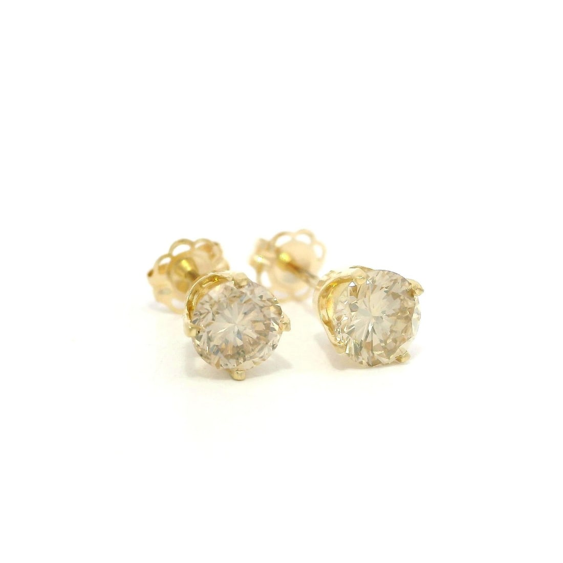 Classic 14k Yellow Gold 1.04ct Fancy Brown Champagne Diamond Earrings: Classic 14k Yellow Gold 1.04ct Fancy Brown Champagne Diamond Earrings Elevate your elegance with these stunning Classic 14k Yellow Gold Stud Earrings, featuring two natural round brilliant cut diamond