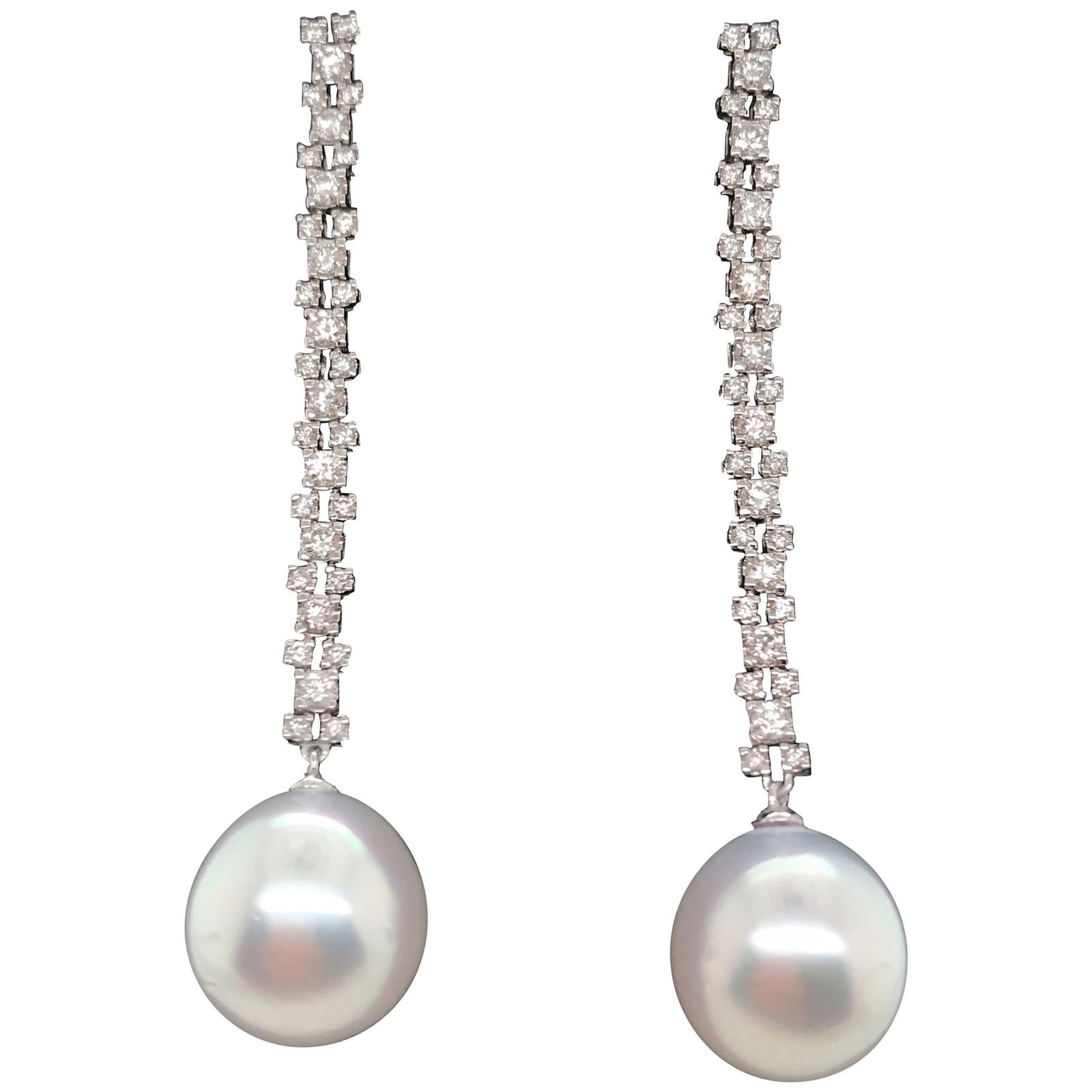 Harbor Diamonds 18K White Gold South Sea Pearl Diamond Drop Earrings: Harbor Diamonds 18K White Gold South Sea Pearl Diamond Drop Earrings Elevate your elegance with these stunning drop earrings crafted from 18K white gold. Featuring two exquisite South Sea pearls, each