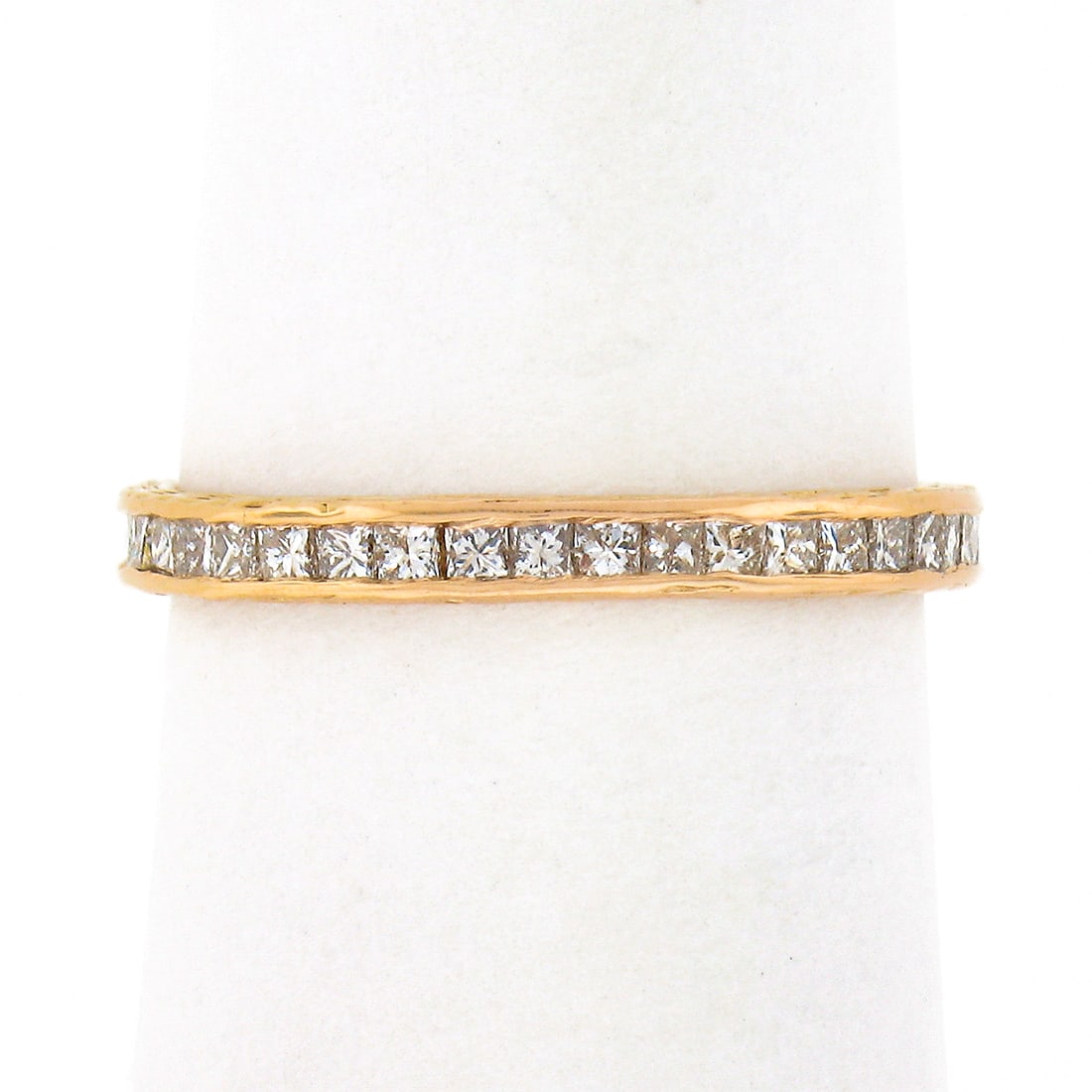 Vintage 18k Rose Gold Eternity Band Ring with Princess Cut Diamonds: Vintage 18k Rose Gold Eternity Band Ring with Princess Cut Diamonds This exquisite vintage eternity band ring is crafted from solid 18k rose gold, showcasing a stunning array of channel-set princess c