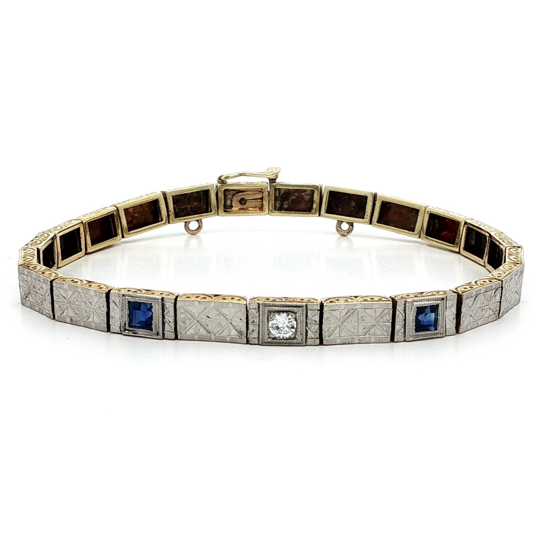 Antique Edwardian 14k White Gold Diamond Sapphire Line Bracelet: Antique Edwardian 14k White Gold Diamond Sapphire Line Bracelet This exquisite Antique Edwardian bracelet showcases a stunning combination of gold and platinum craftsmanship. Featuring a hand-engraved