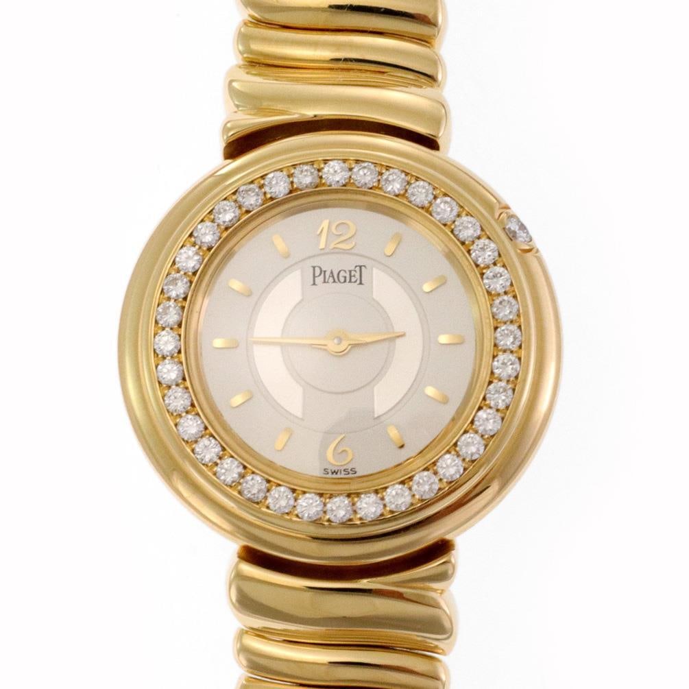 Piaget Possession 18k Yellow Gold Diamond Bezel Ladies Watch 20127: Piaget Possession 18k Yellow Gold Diamond Bezel Ladies Watch 20127 Discover the elegance of this authentic Piaget ladies wristwatch from the Possession Collection. Crafted in luxurious 18k yellow gold
