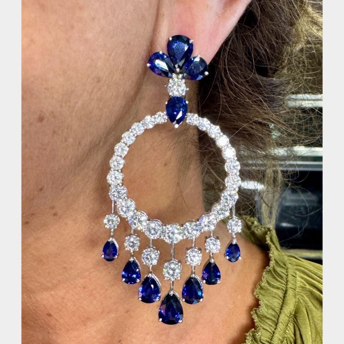 18K White Gold Sapphire Diamond Earrings 22 Ct Sapphires 18 Ct Diamonds: 18K White Gold Sapphire Diamond Earrings 22 Ct Sapphires 18 Ct Diamonds These stunning earrings are crafted from 18K white gold, featuring a captivating arrangement of 22 sapphires with an approximate
