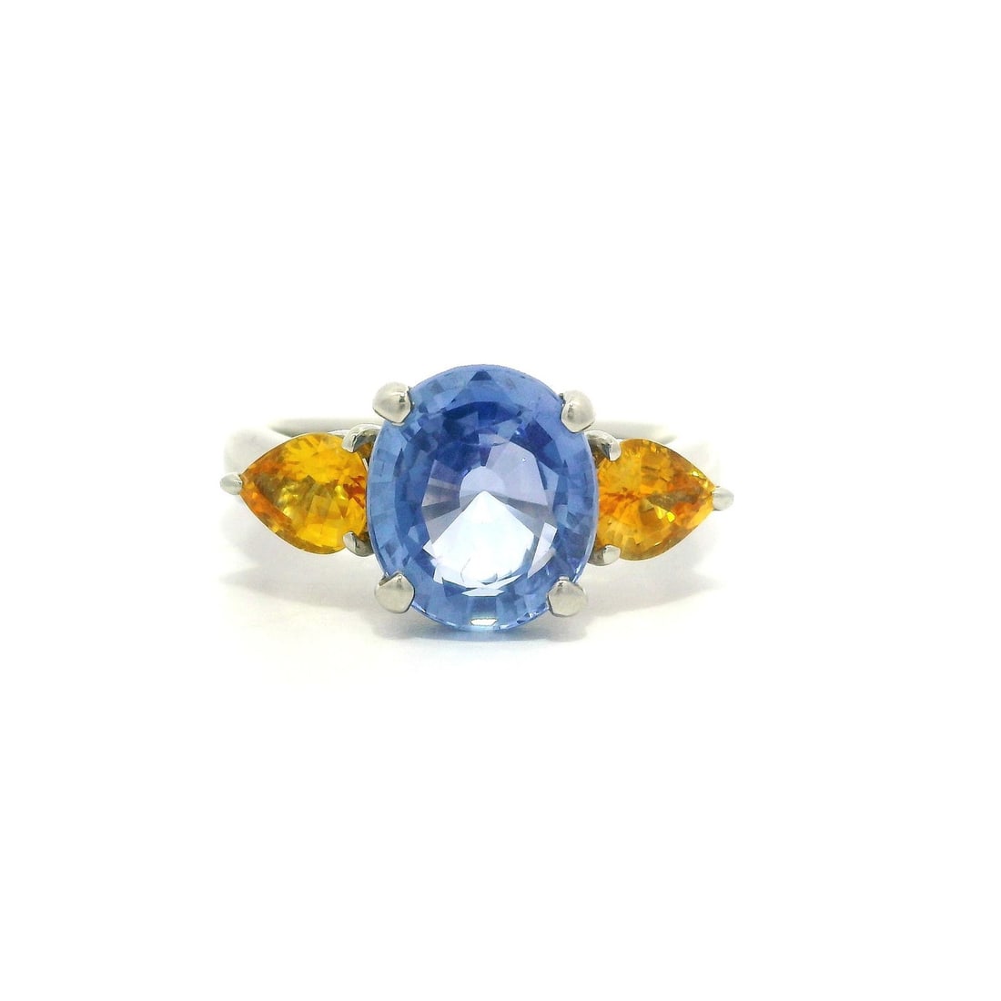 Platinum GIA Certified 4.64ct Blue Sapphire Ring with Yellow Sapphires: Platinum GIA Certified 4.64ct Blue Sapphire Ring with Yellow Sapphires This exquisite ring features a stunning natural genuine sapphire at its center, showcasing a clean cornflower blue color with no