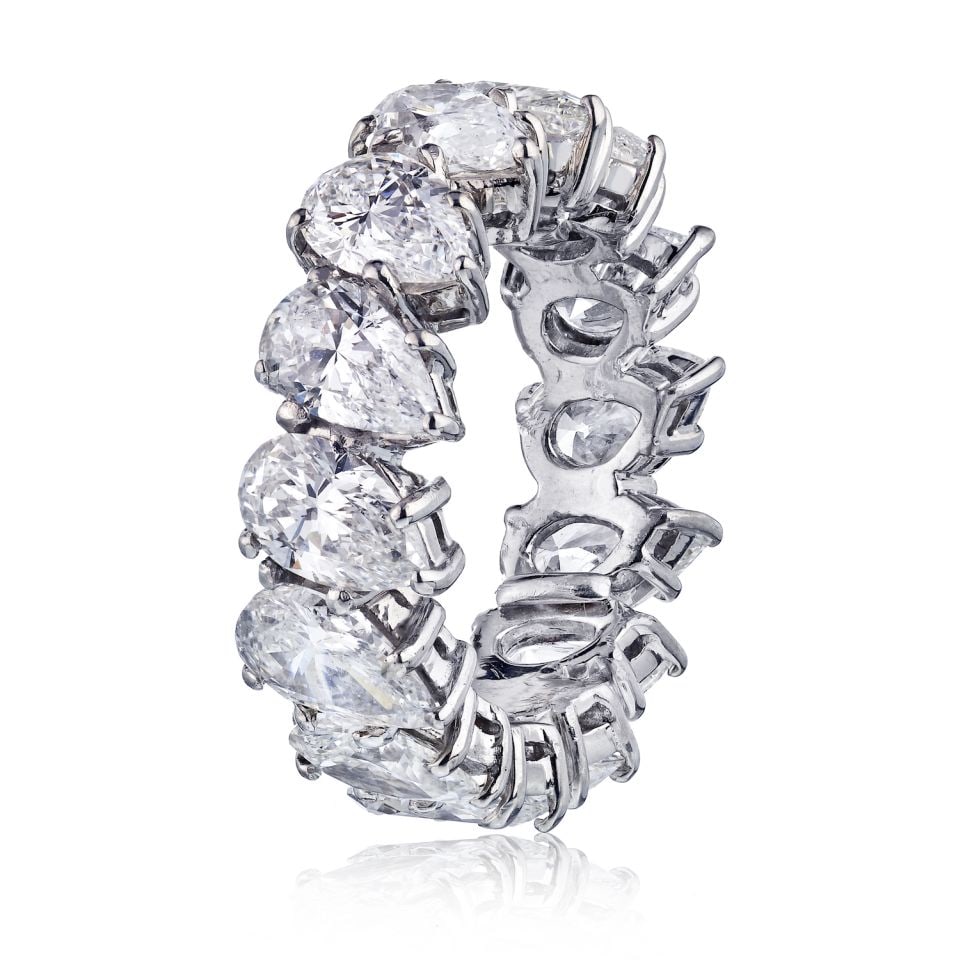 Stunning Platinum Eternity Band 7.50cts Pear Cut Diamonds: Stunning Platinum Eternity Band 7.50cts Pear Cut Diamonds This exquisite Platinum Eternity Band features a stunning arrangement of 14 matching pear-cut diamonds, totaling 7.50 carats. Crafted from hig