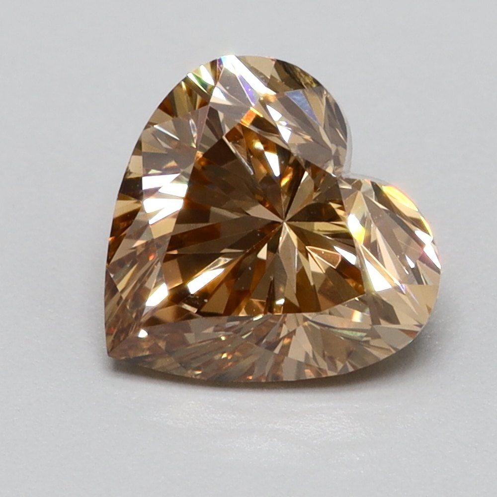 Loose Diamond - HEART 0.68ct Fancy Vivid Brownish Brown VS2: Loose Diamond - HEART 0.68ct Fancy Vivid Brownish Brown VS2 Source: This is a real non-mined Diamond that has been grown in a lab Shape: HEART Carats: 0.68 Color: Fancy Vivid Brownish Brown Certificat