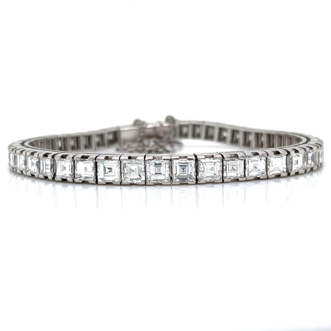 Art Deco Platinum Tennis Bracelet 13.00 Ct Ascher-cut Diamonds: Art Deco Platinum Tennis Bracelet 13.00 Ct Ascher-cut Diamonds This exquisite Art Deco tennis bracelet is crafted from platinum and features 44 stunning Ascher-cut diamonds, totaling approximately 13.