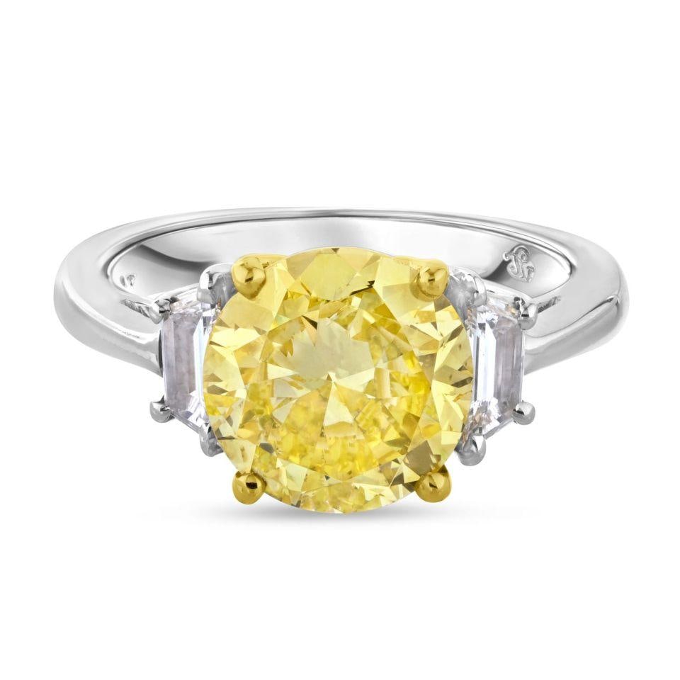 2.90ct GIA Fancy Intense Yellow Diamond Engagement Ring in Platinum & 18K Yellow Gold: 2.90ct GIA Fancy Intense Yellow Diamond Engagement Ring in Platinum & 18K Yellow Gold This exquisite three-stone engagement ring features a stunning 2.90 carat round brilliant cut diamond, graded by G