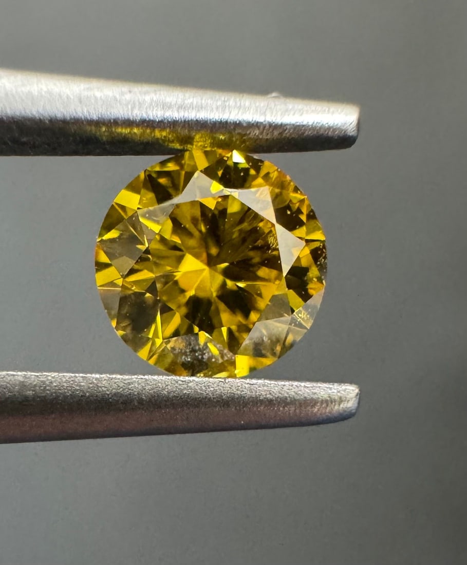 Loose Diamond - ROUND 0.27ct Fancy Vivid Orangey Yellow I2: Loose Diamond - ROUND 0.27ct Fancy Vivid Orangey Yellow I2 Source: Natural Shape: ROUND Carats: 0.27 Color: Fancy Vivid Orangey Yellow Certification: GIA The Diamond Depot Guarantee: All items in this