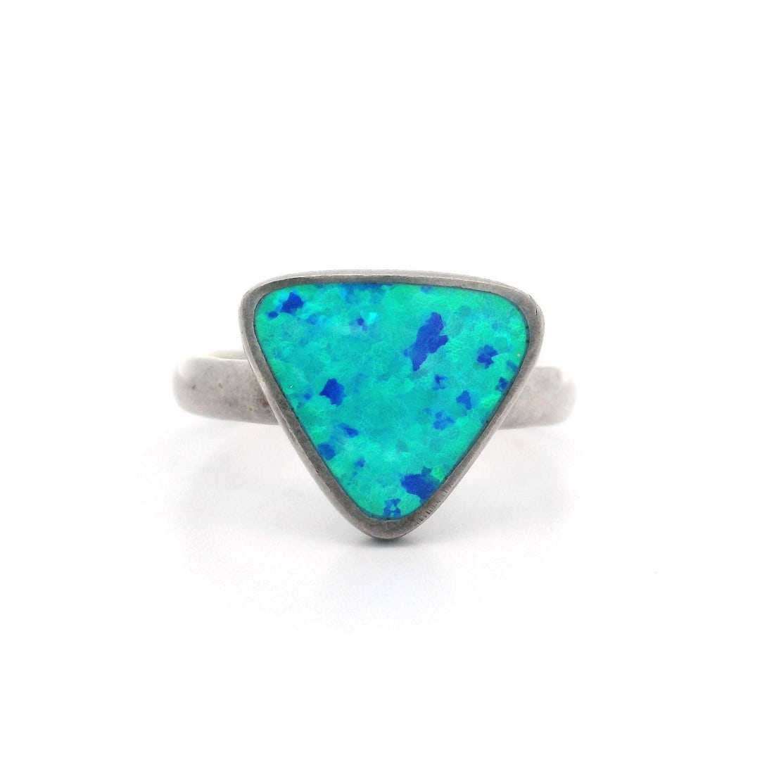 Handmade Sterling Silver Geometric Opal Cocktail Ring 8.5: Handmade Sterling Silver Geometric Opal Cocktail Ring 8.5 This exquisite handmade cocktail ring showcases a stunning geometric design featuring a natural opal stone. The opal, shaped as a triangle cab