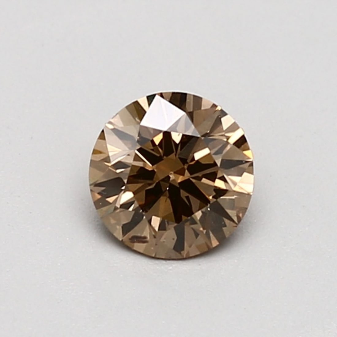 Loose Diamond - ROUND 0.52ct Fancy Orange Brown SI1: Loose Diamond - ROUND 0.52ct Fancy Orange Brown SI1 Source: Natural Shape: ROUND Carats: 0.52 Color: Fancy Orange Brown Certification: GIA Video: