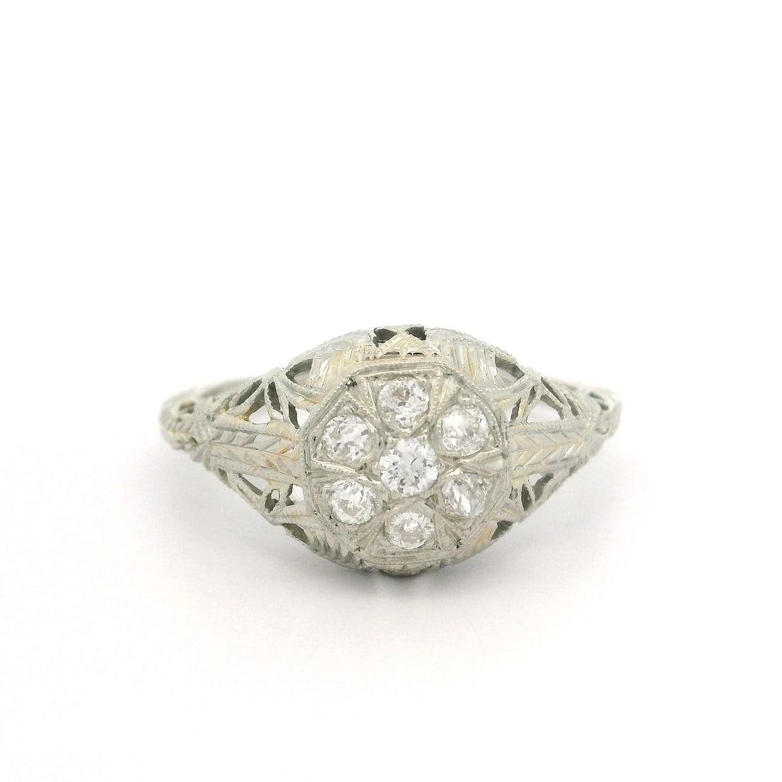 Antique Art Deco 0.18ctw Diamond Filigree White Gold Ring: Antique Art Deco 0.18ctw Diamond Filigree White Gold Ring This stunning Antique Art Deco ring showcases intricate filigree engraving and is adorned with seven natural old European cut diamonds, totali