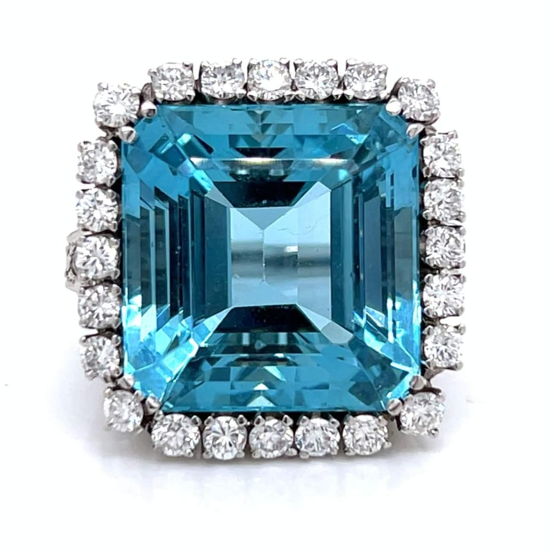 Art Deco Platinum Ring 34.50 Ct Aquamarine & 30 Diamonds: Art Deco Platinum Ring 34.50 Ct Aquamarine & 30 Diamonds Discover this stunning Art Deco ring crafted in platinum, featuring an exquisite aquamarine weighing approximately 34.50 Ct. The vibrant blue c
