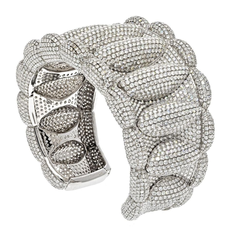 18K White Gold Diamond Pave Cuff Bracelet 85 Carats: 18K White Gold Diamond Pave Cuff Bracelet 85 Carats This stunning cuff bracelet is crafted from luxurious 18K white gold and adorned with an impressive 85 carats of round cut diamonds, creating a bril