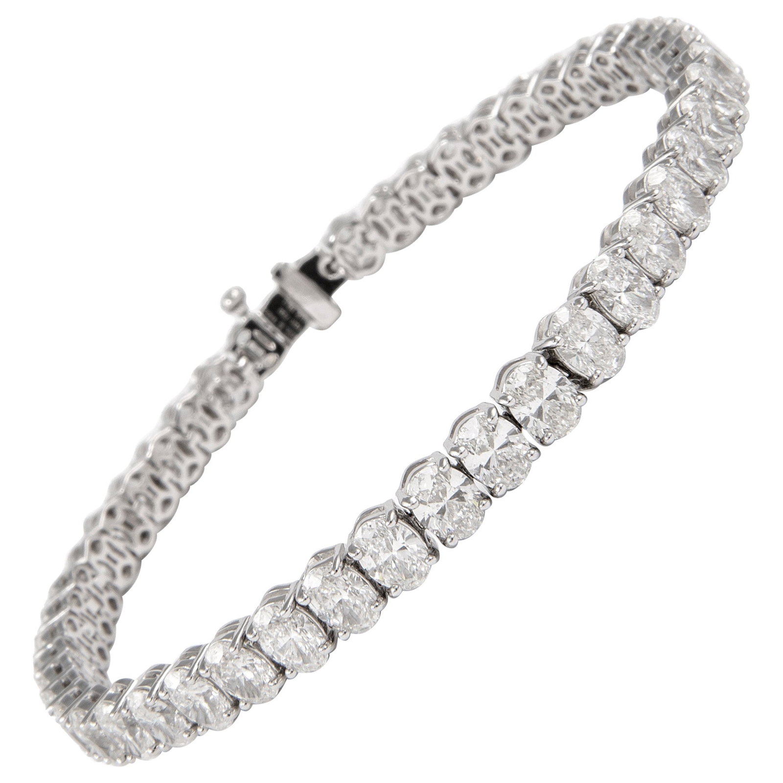 18K White Gold 13.37ct Oval Cut Diamond Tennis Bracelet: 18K White Gold 13.37ct Oval Cut Diamond Tennis Bracelet This exquisite modern tennis bracelet features a stunning arrangement of 45 oval cut diamonds totaling 13.37 carats. Each diamond showcases an a