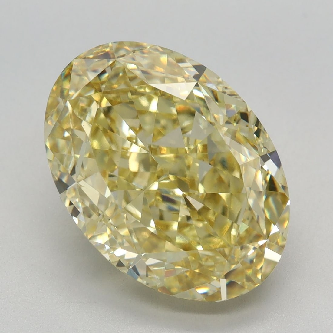 Loose Diamond - OVAL 6.05ct Fancy Vivid Yellow VVS2: Loose Diamond - OVAL 6.05ct Fancy Vivid Yellow VVS2 Source: This is a real non-mined Diamond that has been grown in a lab Shape: OVAL Carats: 6.05 Color: Fancy Vivid Yellow Certification: IGI Video: