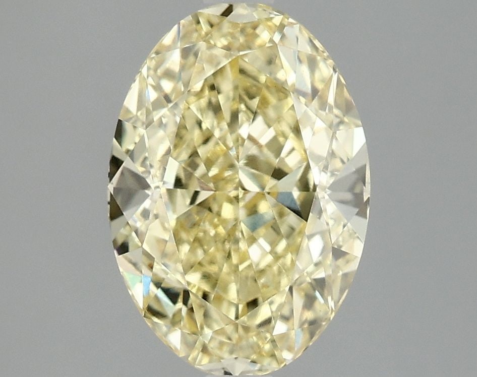 Loose Diamond - OVAL 3.1ct Fancy Vivid Yellow VVS2: Loose Diamond - OVAL 3.1ct Fancy Vivid Yellow VVS2 Source: This is a real non-mined Diamond that has been grown in a lab Shape: OVAL Carats: 3.1 Color: Fancy Vivid Yellow Certification: IGI Video: