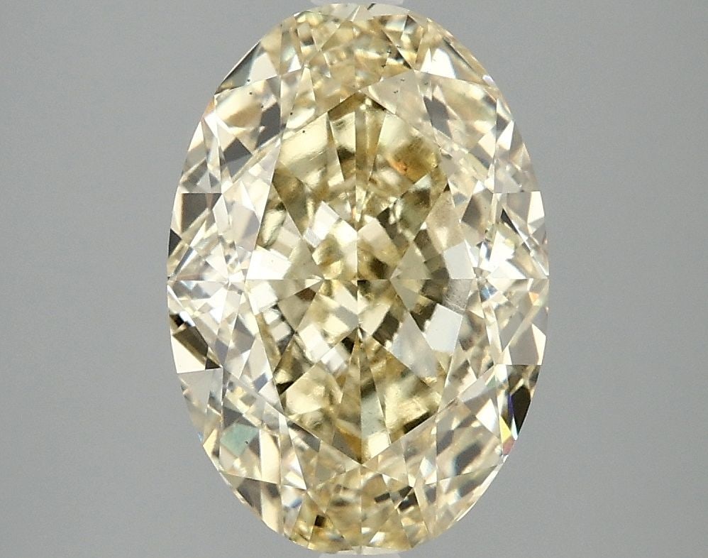 Loose Diamond - OVAL 4.07ct Fancy Vivid Yellow VS2: Loose Diamond - OVAL 4.07ct Fancy Vivid Yellow VS2 Source: This is a real non-mined Diamond that has been grown in a lab Shape: OVAL Carats: 4.07 Color: Fancy Vivid Yellow Certification: IGI Video: