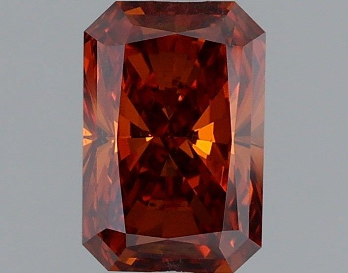 Loose Diamond - RADIANT 1.0ct Fancy Vivid Orange VS1: Loose Diamond - RADIANT 1.0ct Fancy Vivid Orange VS1 Source: This is a real non-mined Diamond that has been grown in a lab Shape: RADIANT Carats: 1.0 Color: Fancy Vivid Orange Certification: IGI Video