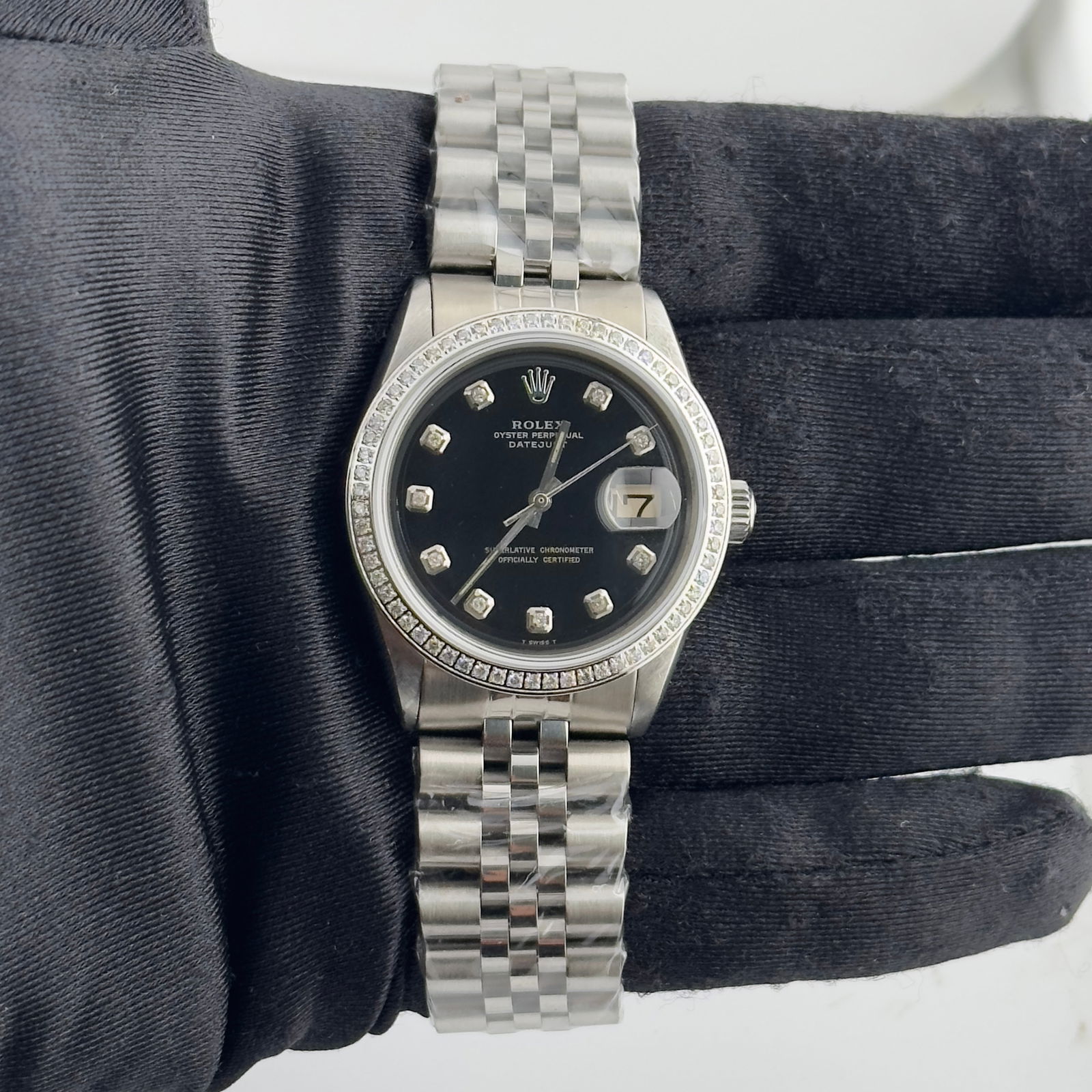 Datejust Ref 1601 Watch Aftermarket Black Diamond Dial Pave Diamond Bezel Jubilee Bracelet: Datejust Ref 1601 Watch Aftermarket Black Diamond Dial Pave Diamond Bezel Jubilee Bracelet This is a men's Rolex Datejust watch, reference 1601, featuring an aftermarket black diamond dial and an afte