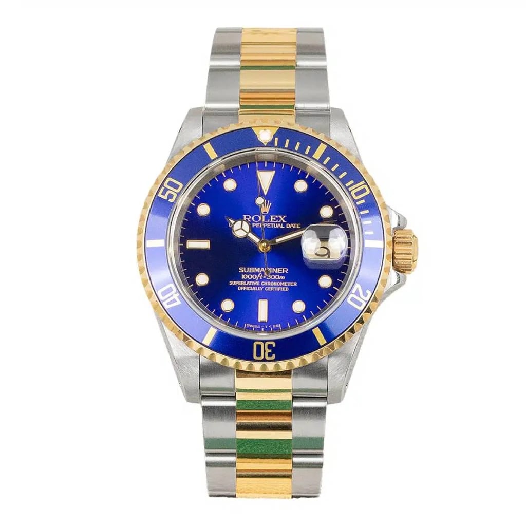 1993 Oyster Bracelet Submariner Ref 16613 Blue Dial Watch with Papers: 1993 Oyster Bracelet Submariner Ref 16613 Blue Dial Watch with Papers This Rolex Submariner features a striking blue dial housed in a classic Oyster case. The watch includes an aluminum bezel and is p