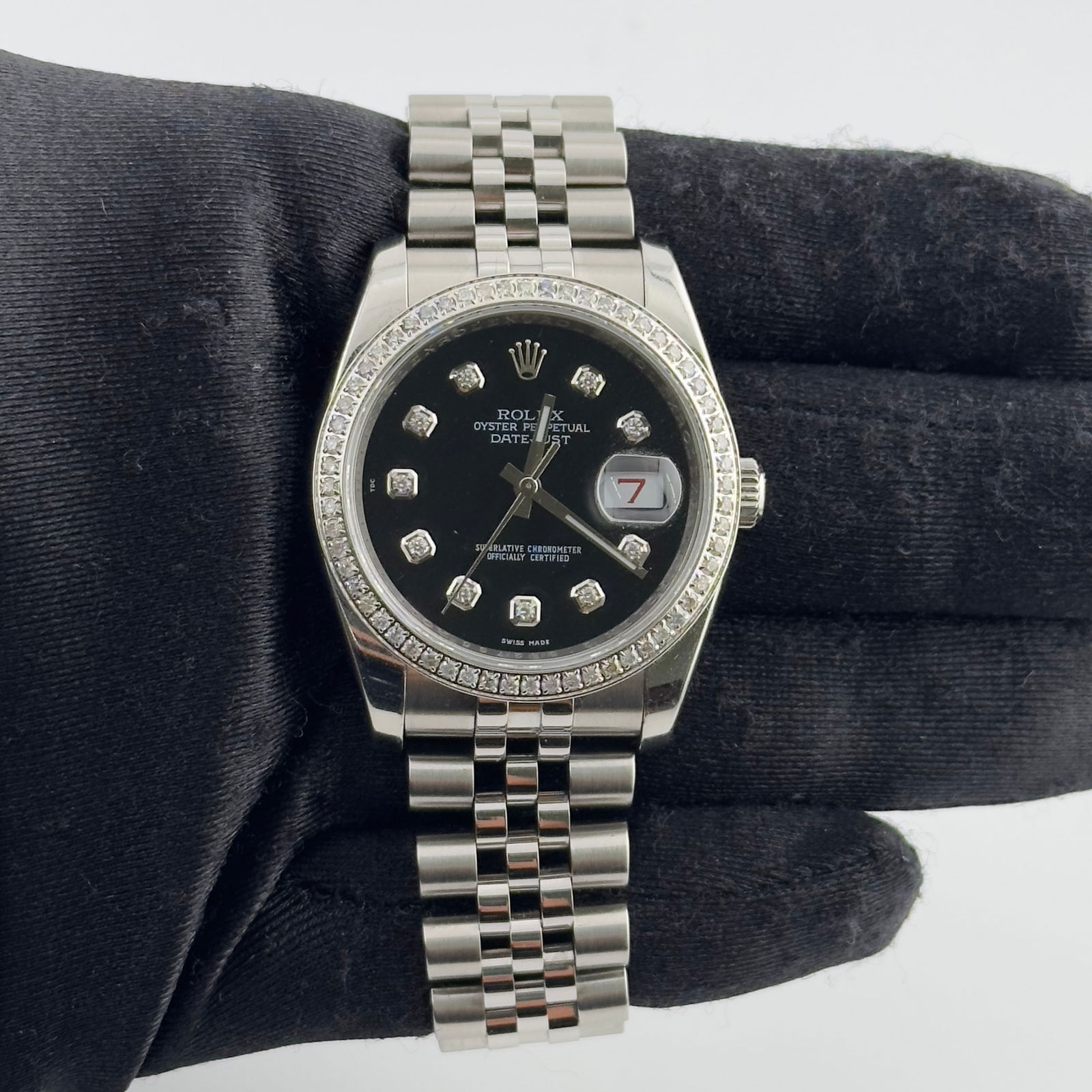 Rolex 116200 Datejust Mens Watch With Aftermarket Black Diamond Dial Jubilee: Rolex 116200 Datejust Mens Watch With Aftermarket Black Diamond Dial Jubilee This Rolex Datejust features an aftermarket black dial adorned with diamond hour markers and a diamond pave bezel. It is pr