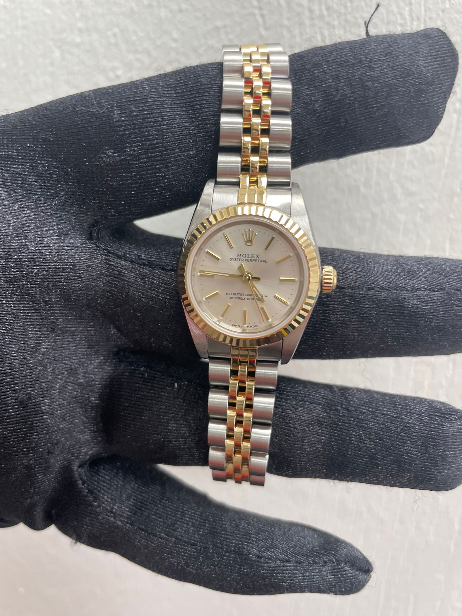 Ladies Rolex 76193 Oyster Perpetual Silver Dial Jubilee Bracelet with Papers 2002: Ladies Rolex 76193 Oyster Perpetual Silver Dial Jubilee Bracelet with Papers 2002 This ladies' Rolex Oyster Perpetual features a silver dial and a fluted bezel, paired with the signature Jubilee brace
