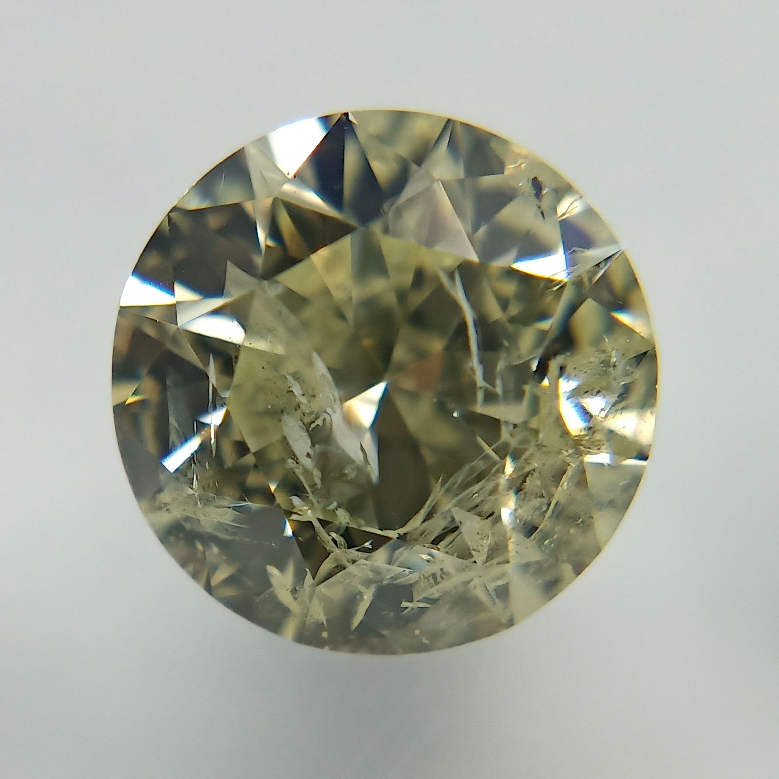 Loose Diamond - ROUND 1.5ct Very Light Yellow I2: Loose Diamond - ROUND 1.5ct Very Light Yellow I2 Source: Natural Shape: ROUND Carats: 1.5 Color: Very Light Yellow Certification: IGI The Diamond Depot Guarantee: All items in this auction are guarant