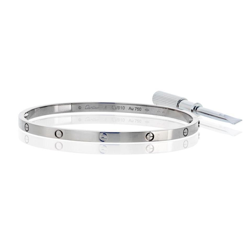 Cartier Love Small Model 18K White Gold Bracelet Size 18 with Service Paper: Cartier Love Small Model 18K White Gold Bracelet Size 18 with Service Paper This exquisite Cartier Love bracelet features an elegant small model design crafted from 18K white gold. Weighing 21.6 grams