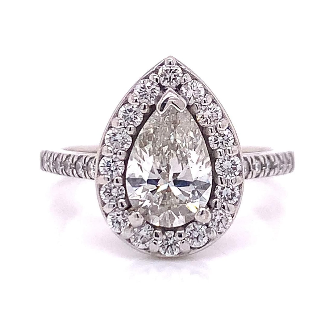 14K White Gold GIA Certified 1.07 Ct Pear-Shape Diamond Ring: 14K White Gold GIA Certified 1.07 Ct Pear-Shape Diamond Ring This exquisite 14K white gold ring features a stunning GIA certified 1.07 Ct. pear-shape diamond at its center, showcasing a beautiful I co
