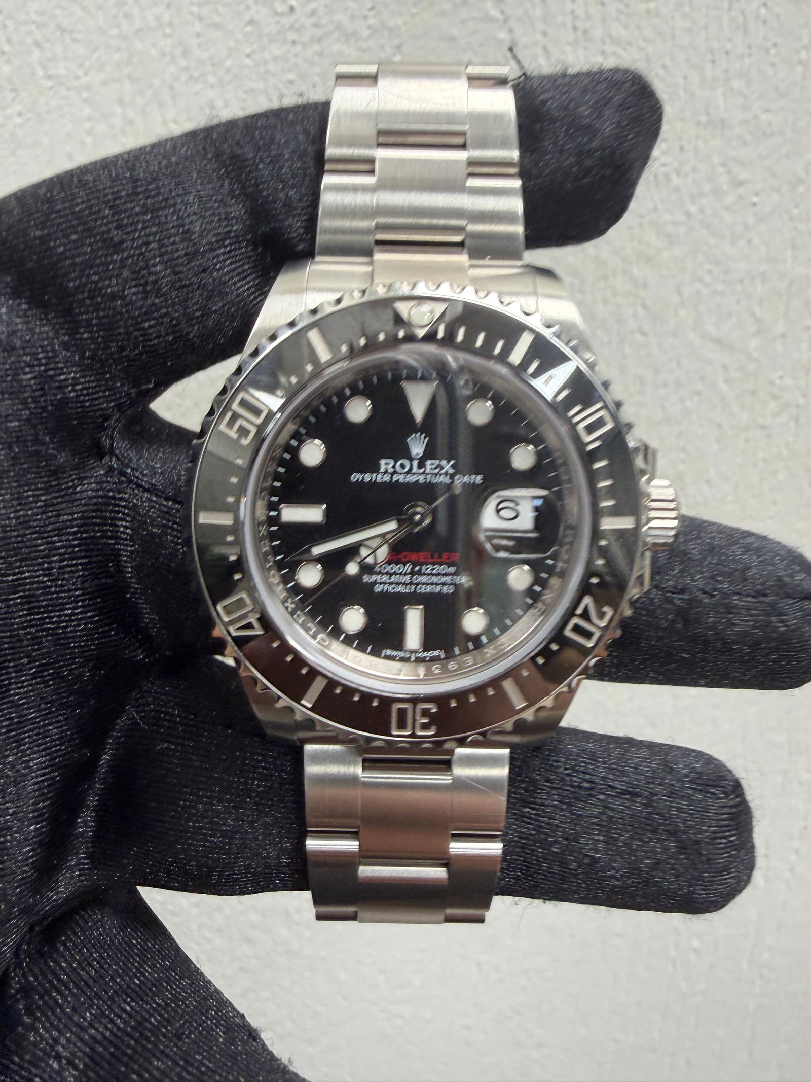 2018 Rolex Sea-Dweller 126600 Oyster Bracelet Black Dial with White New Style Card: 2018 Rolex Sea-Dweller 126600 Oyster Bracelet Black Dial with White New Style Card This Rolex Sea-Dweller features a black dial and a ceramic bezel, paired with an Oyster bracelet. The watch is a men'