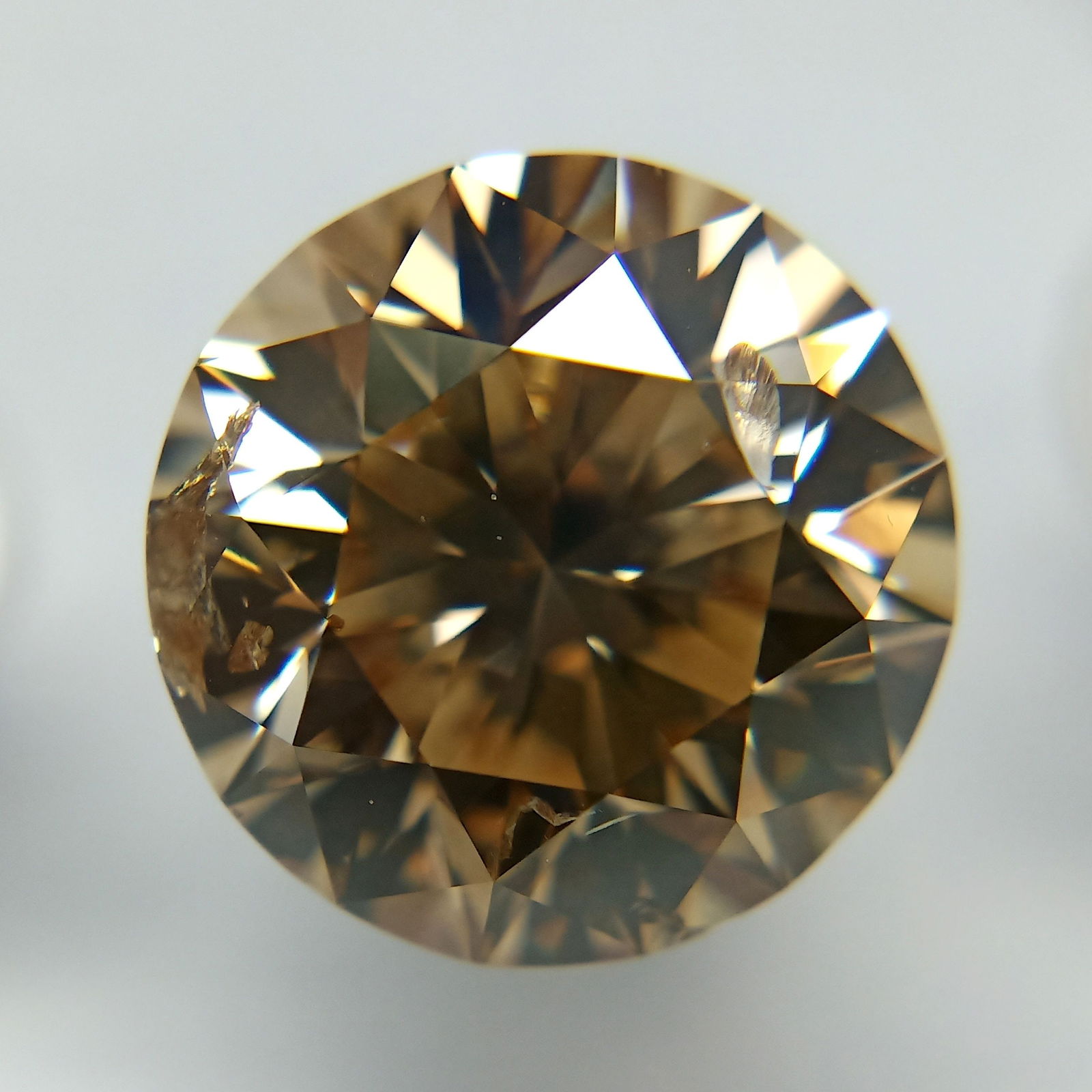 Loose Diamond - ROUND 5.02ct Fancy Yellowish Brown: Loose Diamond - ROUND 5.02ct Fancy Yellowish Brown Source: Natural Shape: ROUND Carats: 5.02 Color: Fancy Yellowish Brown Certification: GIA The Diamond Depot Guarantee: All items in this auction