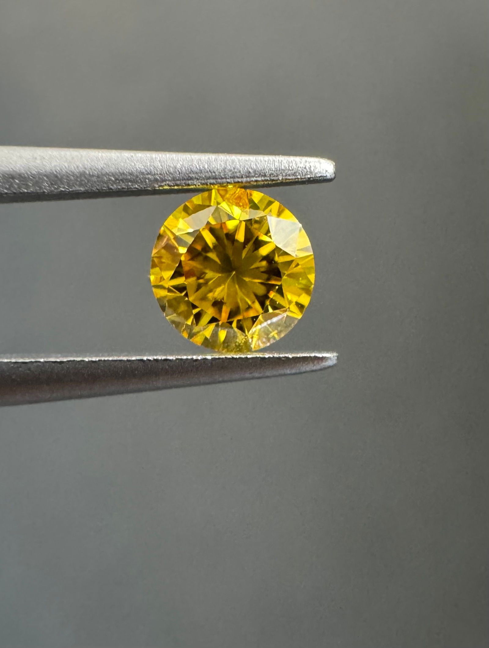 Loose Diamond - ROUND 0.22ct Fancy Vivid Orangey Yellow I1: Loose Diamond - ROUND 0.22ct Fancy Vivid Orangey Yellow I1 Source: Natural Shape: ROUND Carats: 0.22 Color: Fancy Vivid Orangey Yellow Certification: GIA The Diamond Depot Guarantee: All items in this